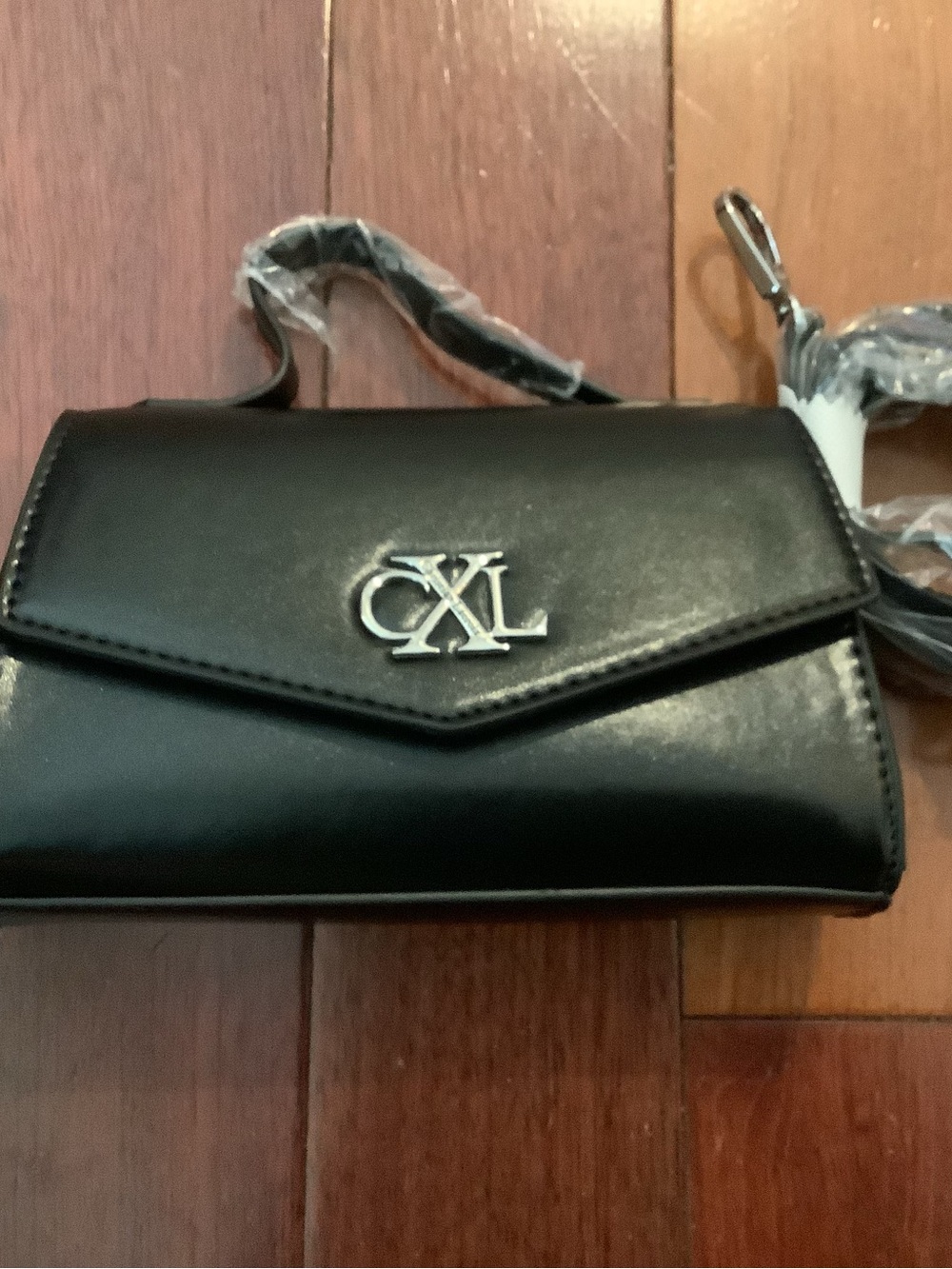 Christian Lacroix Black Crossbody handbang with crossbody strap and Silver Logo